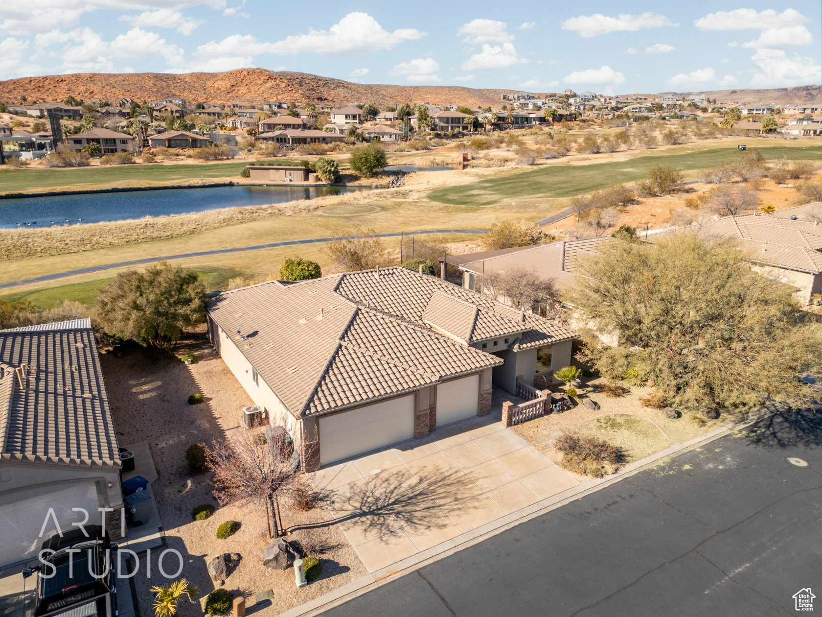 Birds eye view of property featuring a water and mountain view