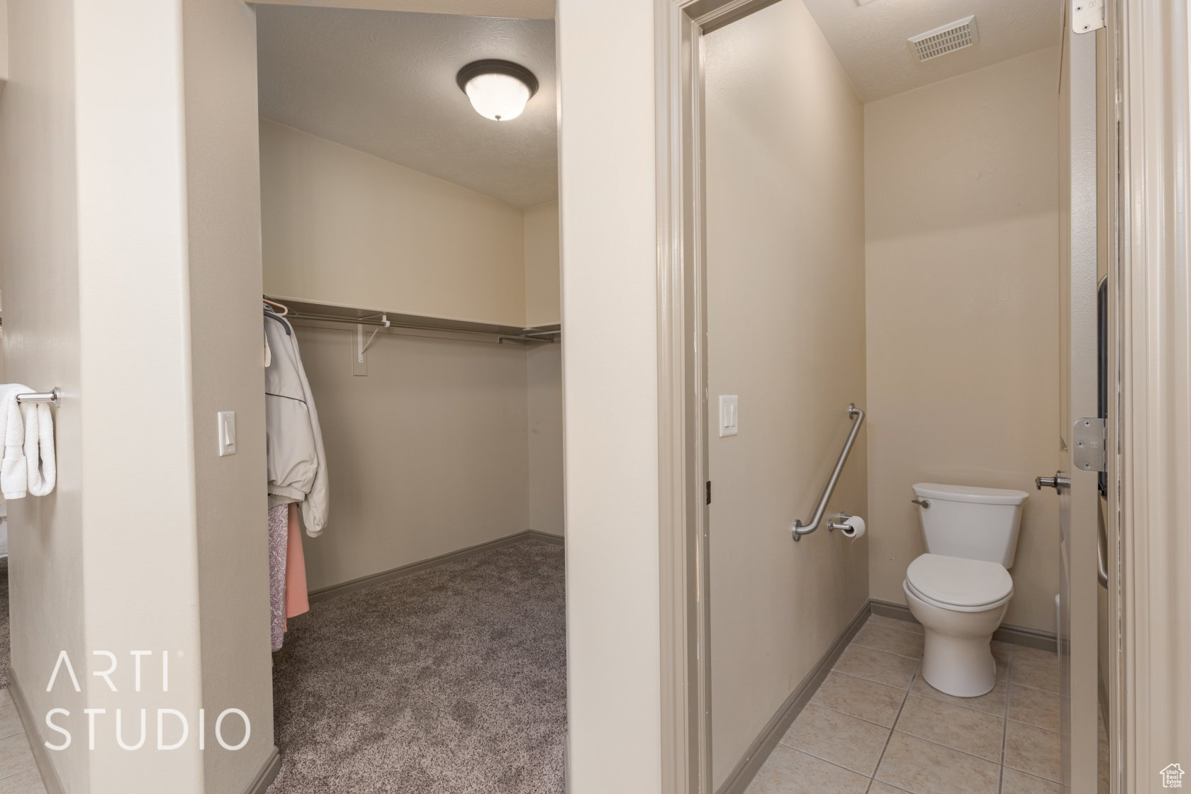 Bathroom featuring tile patterned floors and toilet