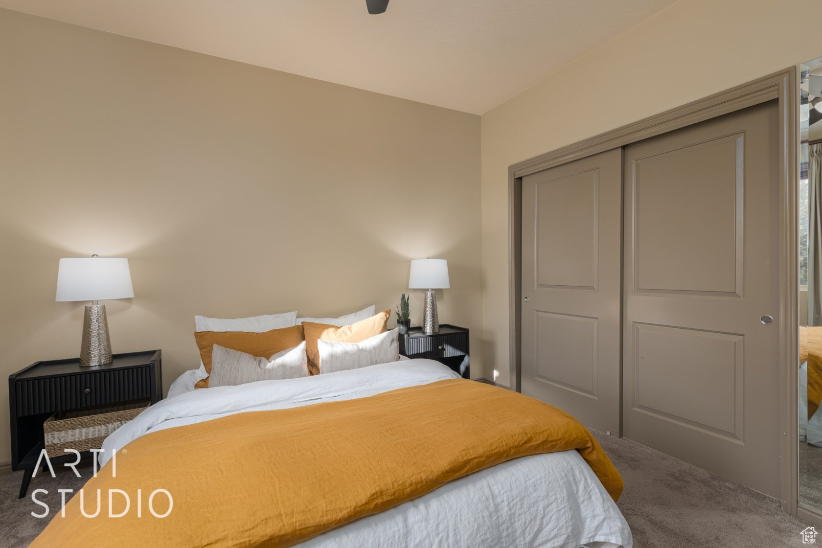 Carpeted bedroom featuring a closet