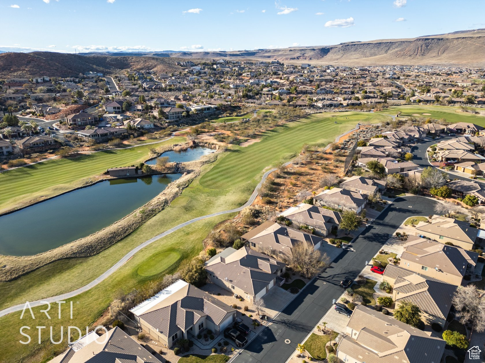 Drone / aerial view with a water and mountain view