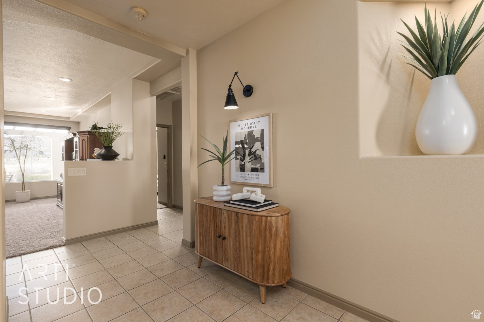 Hall with light tile patterned floors
