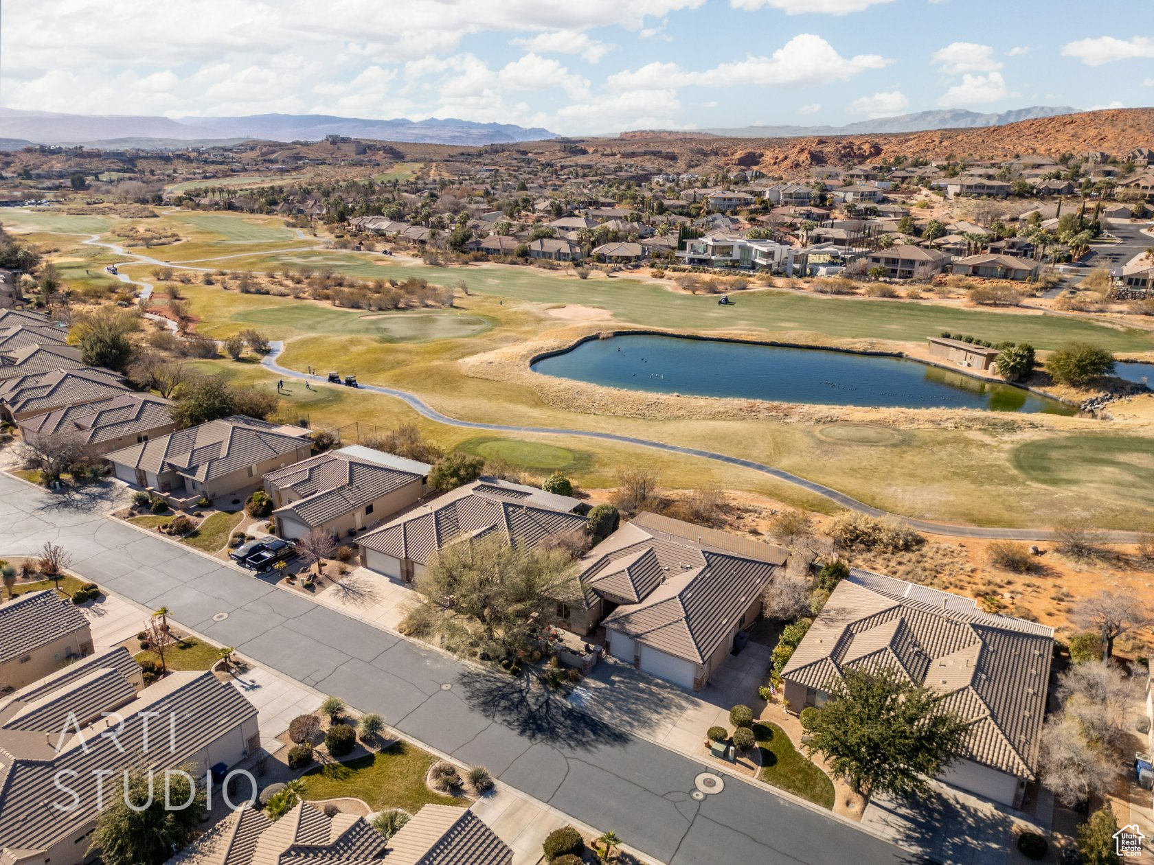 Birds eye view of property featuring a water and mountain view