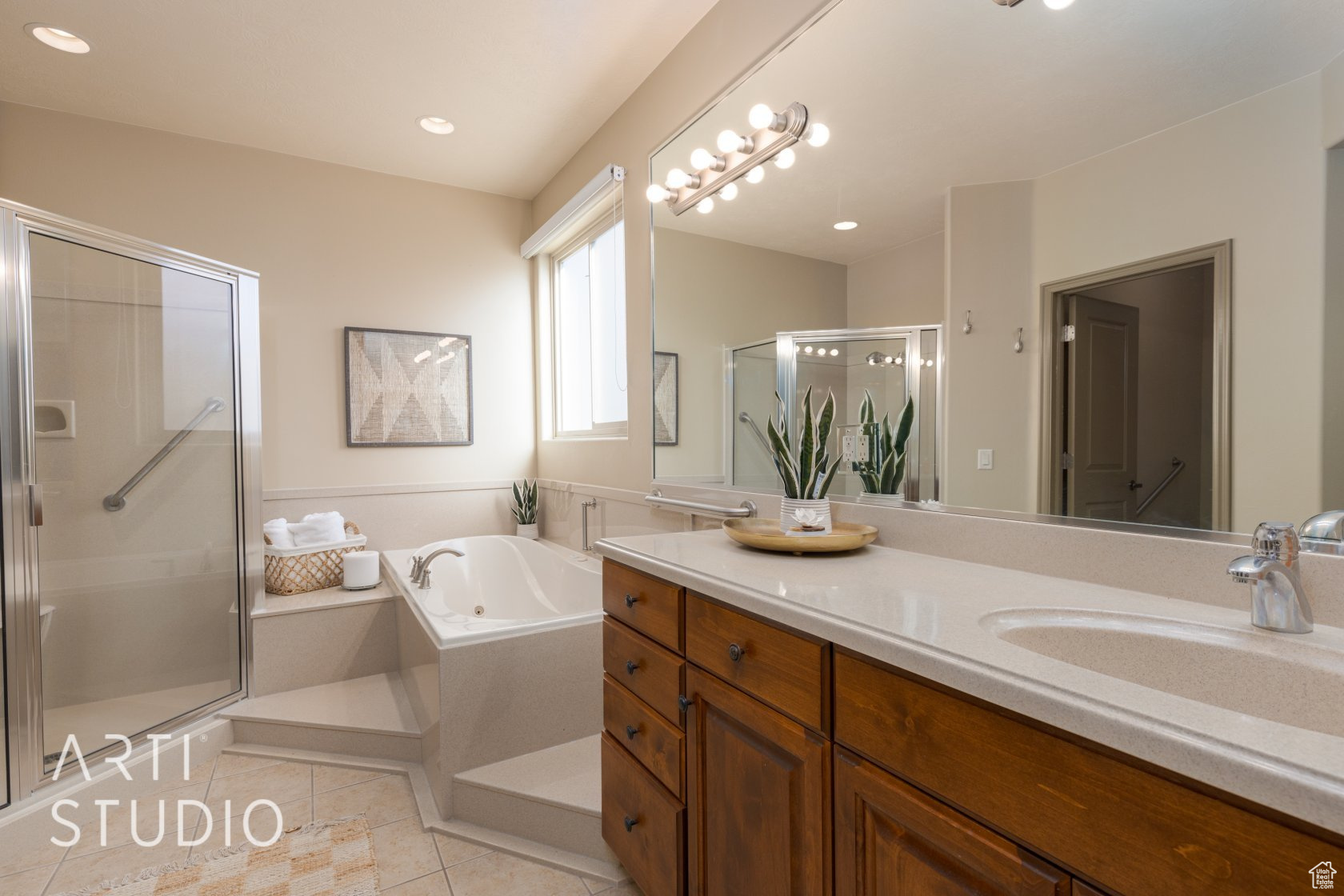 Bathroom with tile patterned floors, vanity, and plus walk in shower