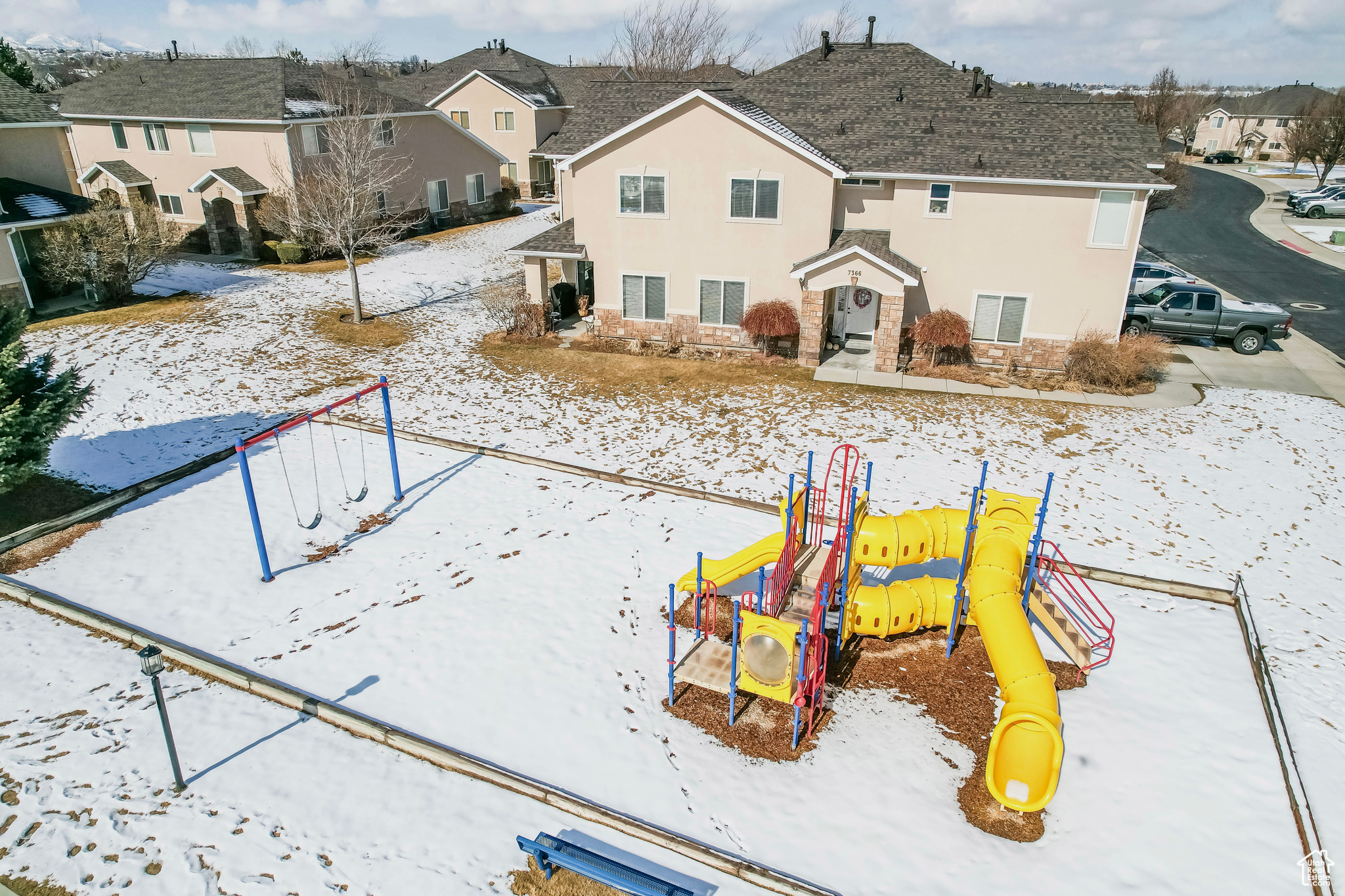 Exterior space with a playground and a residential view
