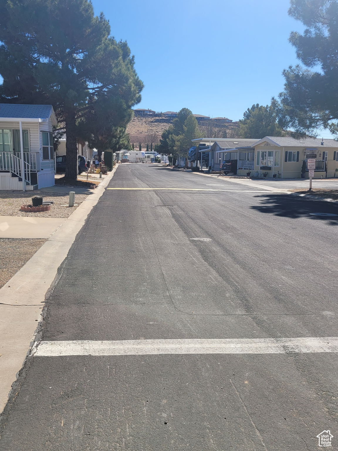 View of street featuring a residential view and sidewalks