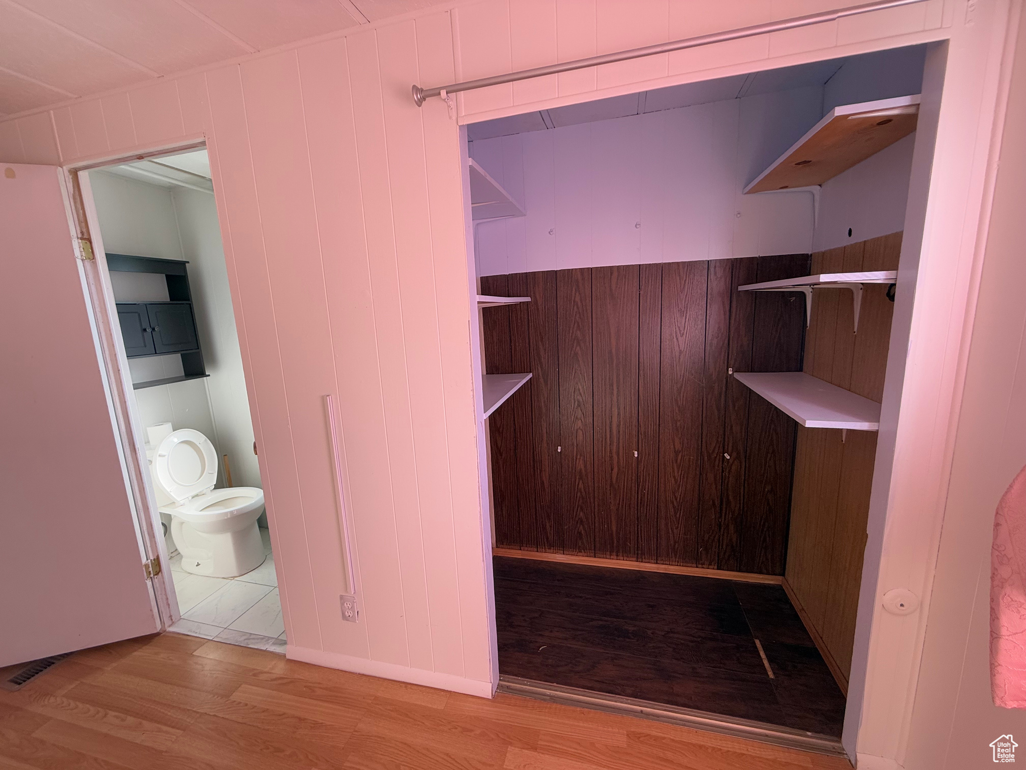 Walk in closet featuring light wood finished floors