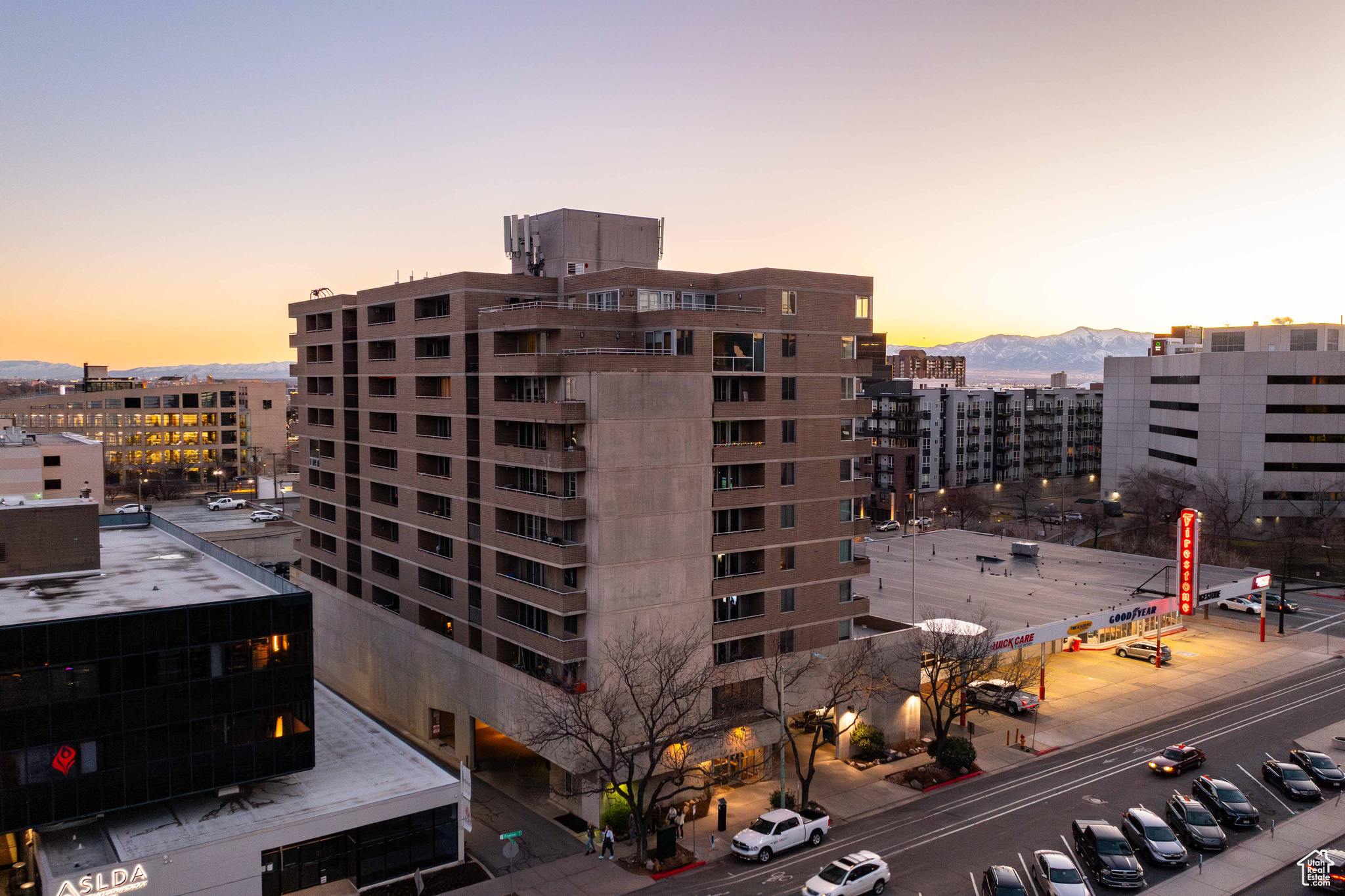 Property at dusk with a city view