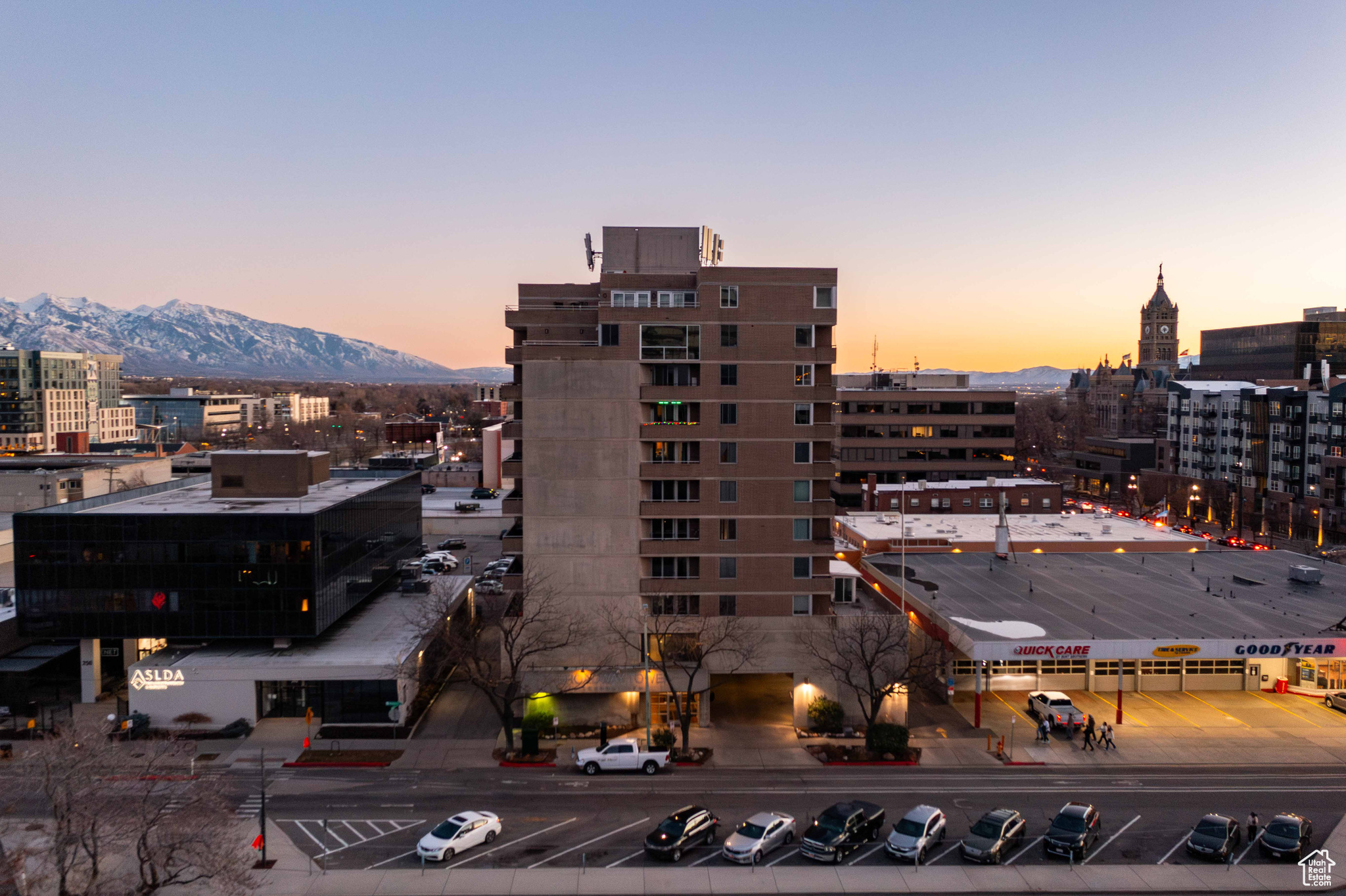 Property at dusk with a view of city and a mountain view