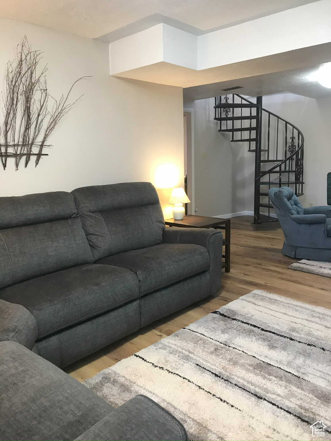 Living area featuring light wood-type flooring and stairway