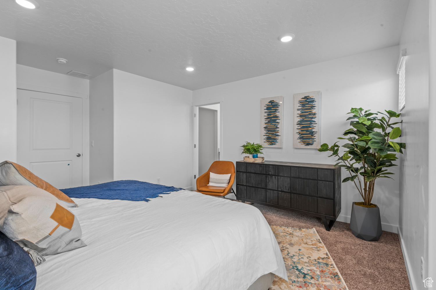 Bedroom with baseboards, a textured ceiling, carpet, and recessed lighting