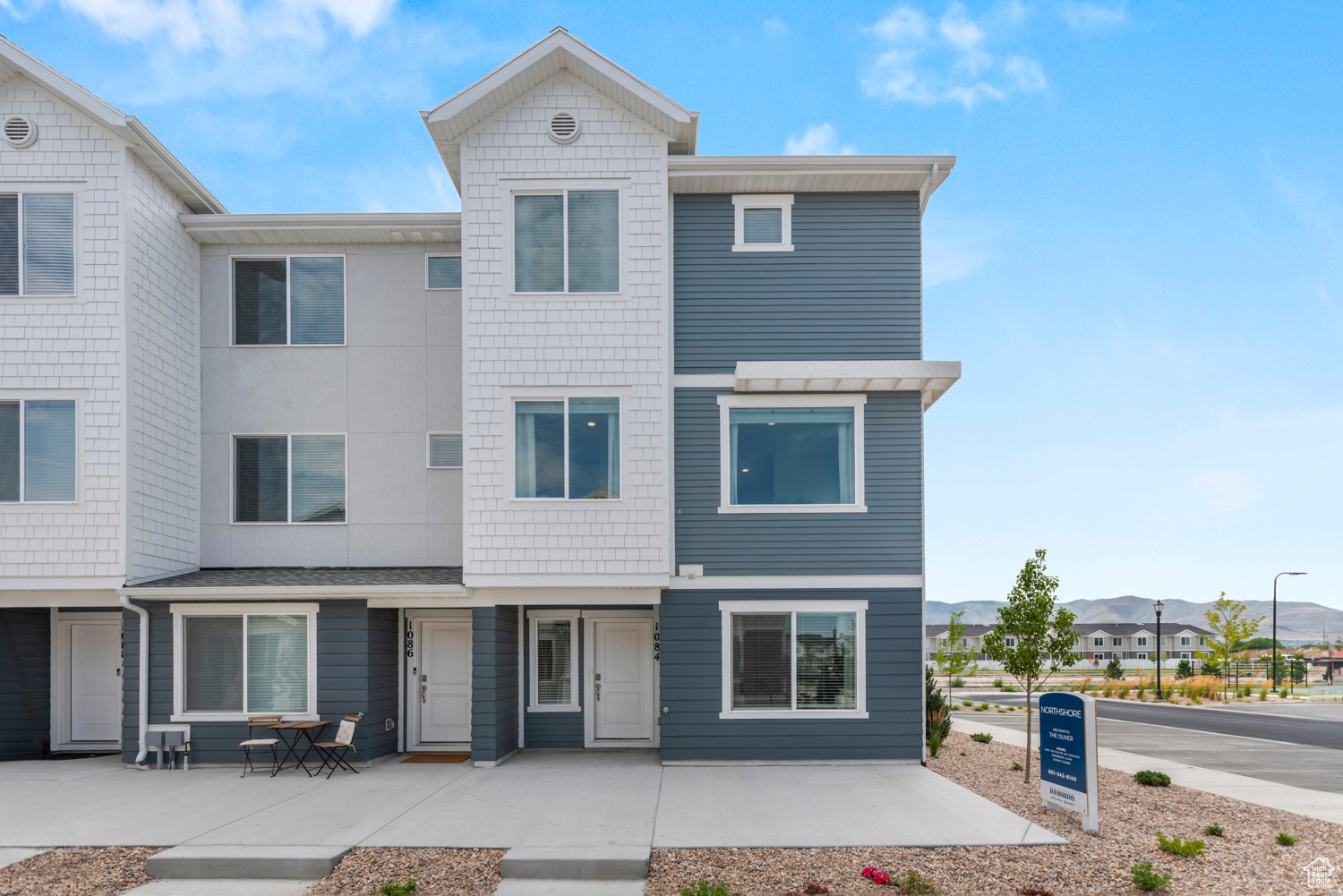 Multi unit property with a residential view and a patio area