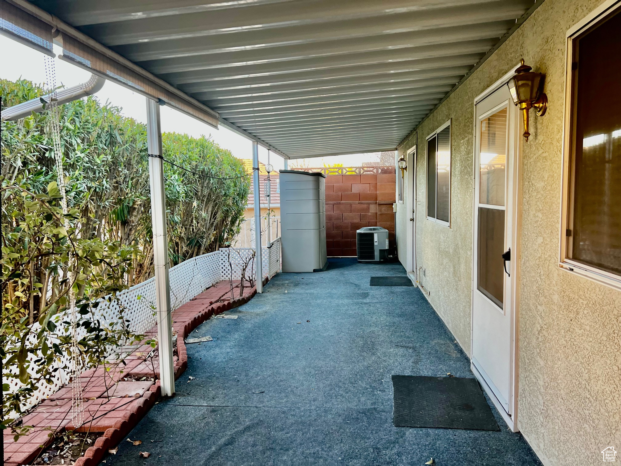 View of patio / terrace with central AC and fence