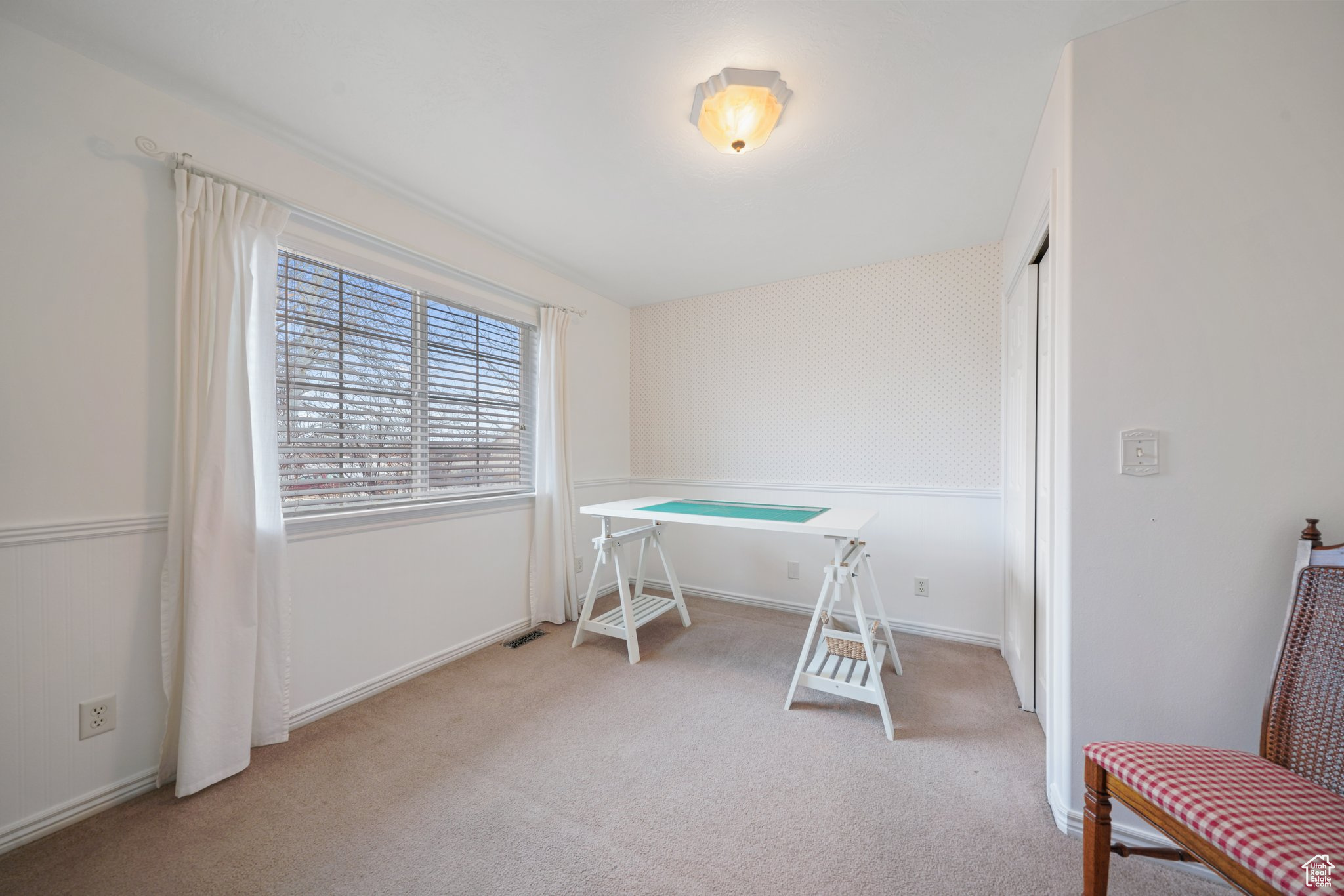 Office area featuring light colored carpet
