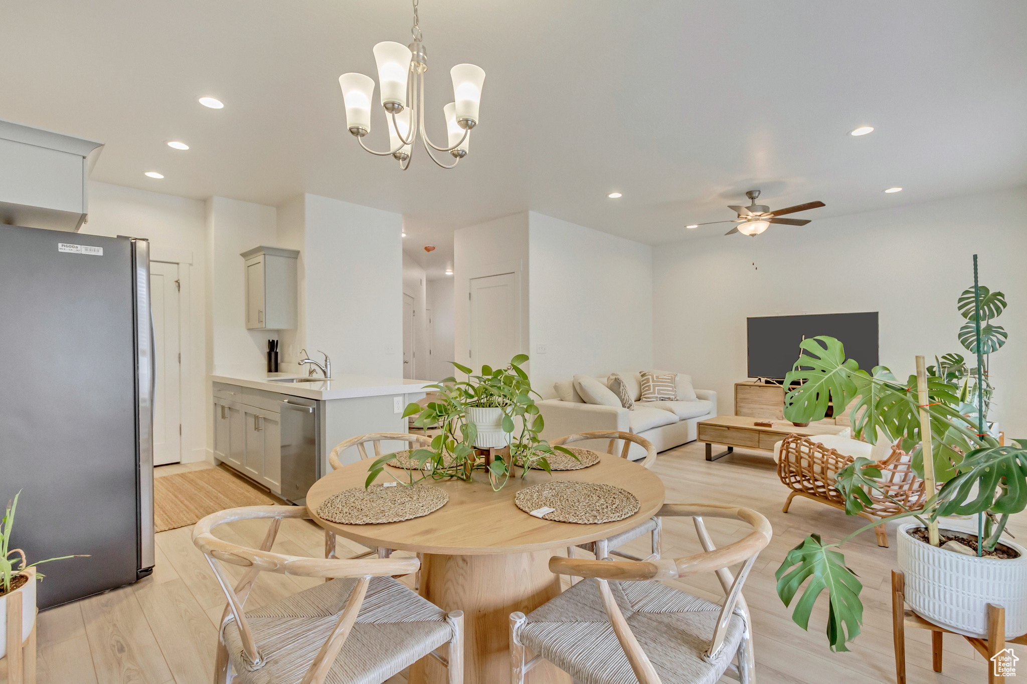 Dining area with light wood-type flooring, a ceiling fan, and recessed lighting