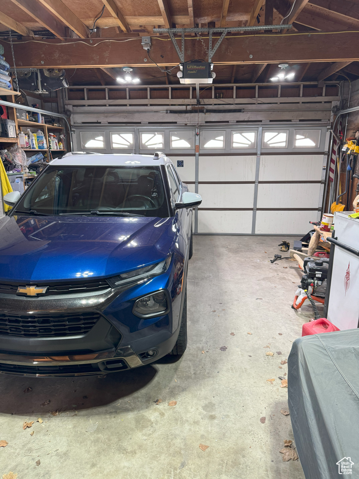 Two-car garage featuring a garage door opener