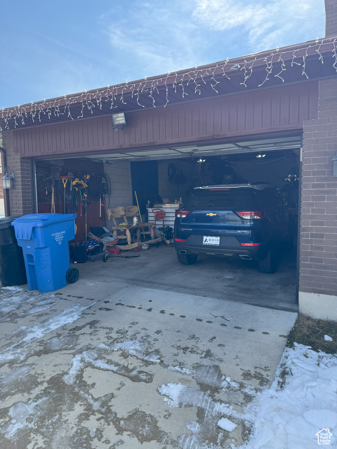 Garage featuring driveway