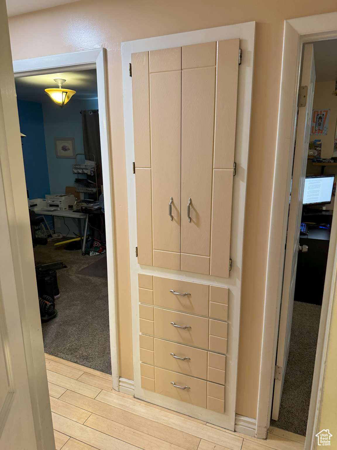 View of hall build-in linen closet