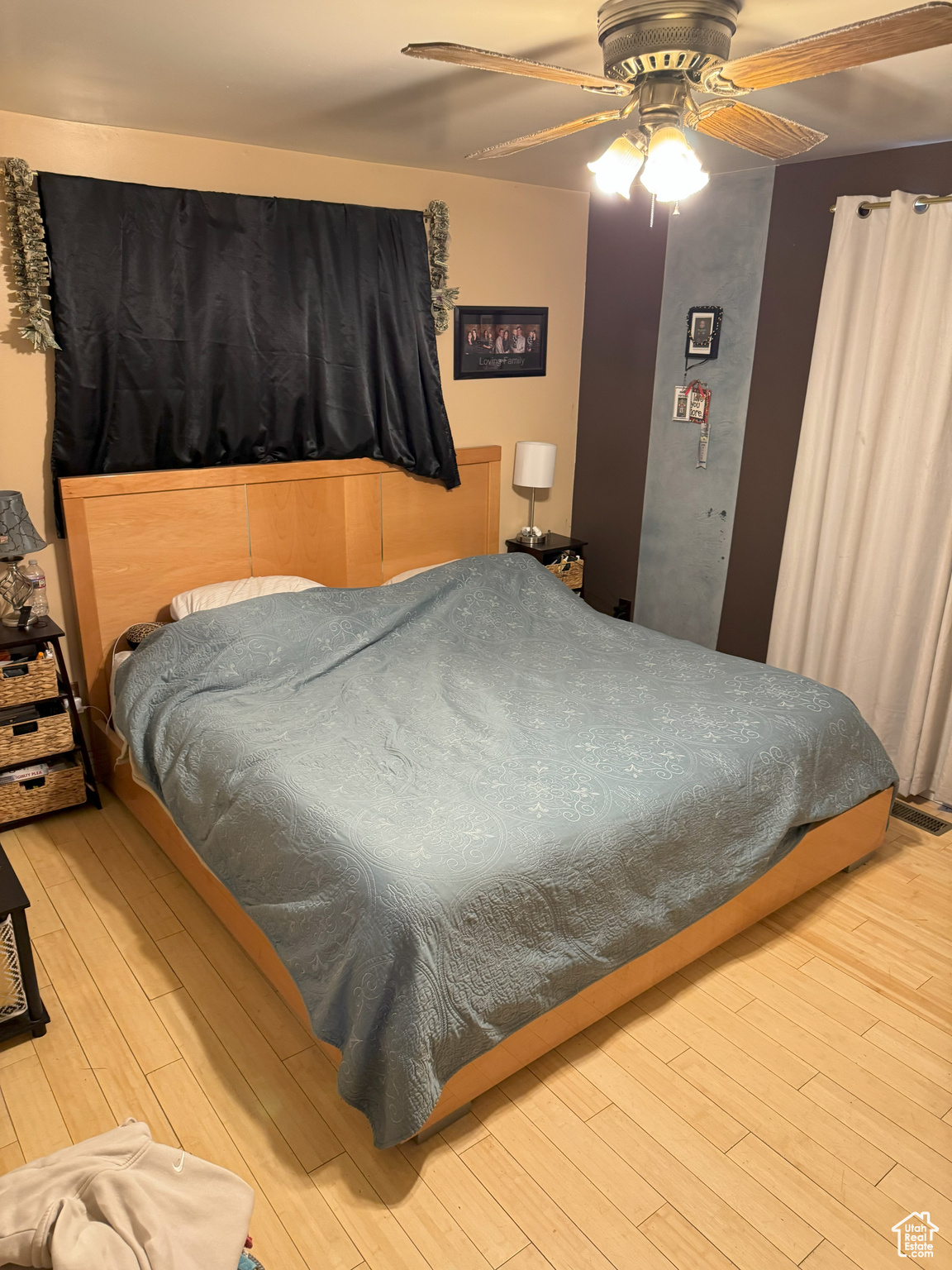 Bedroom featuring a ceiling fan and wood finished floors