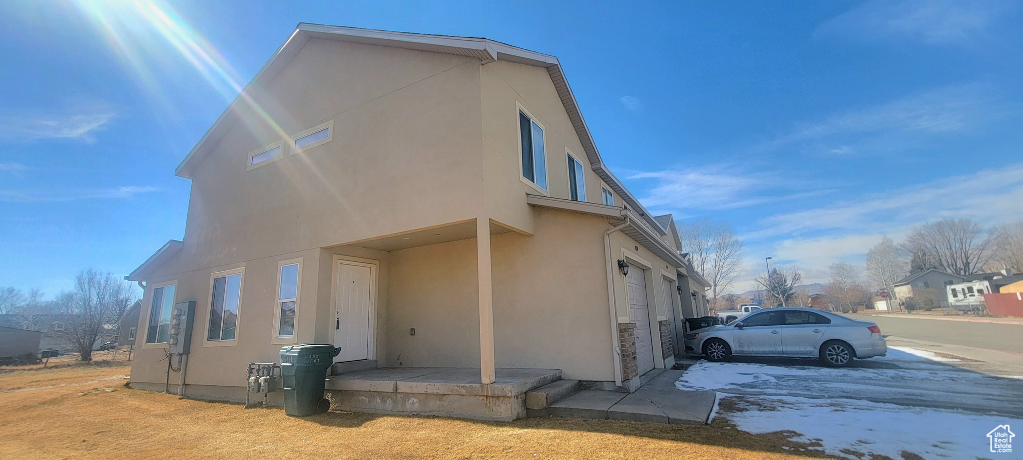 View of side of property featuring stucco siding