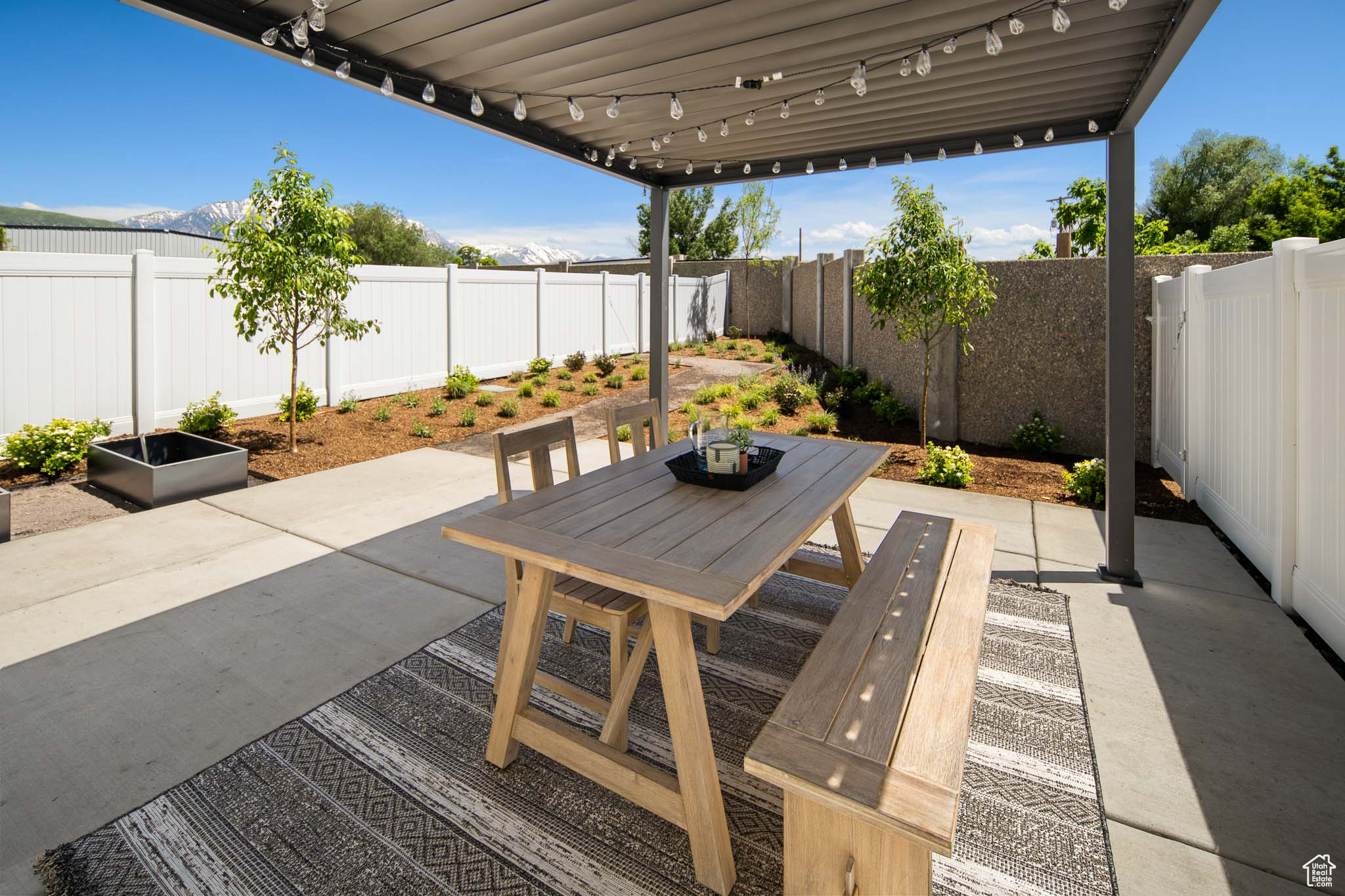 View of patio featuring outdoor dining area and a fenced backyard