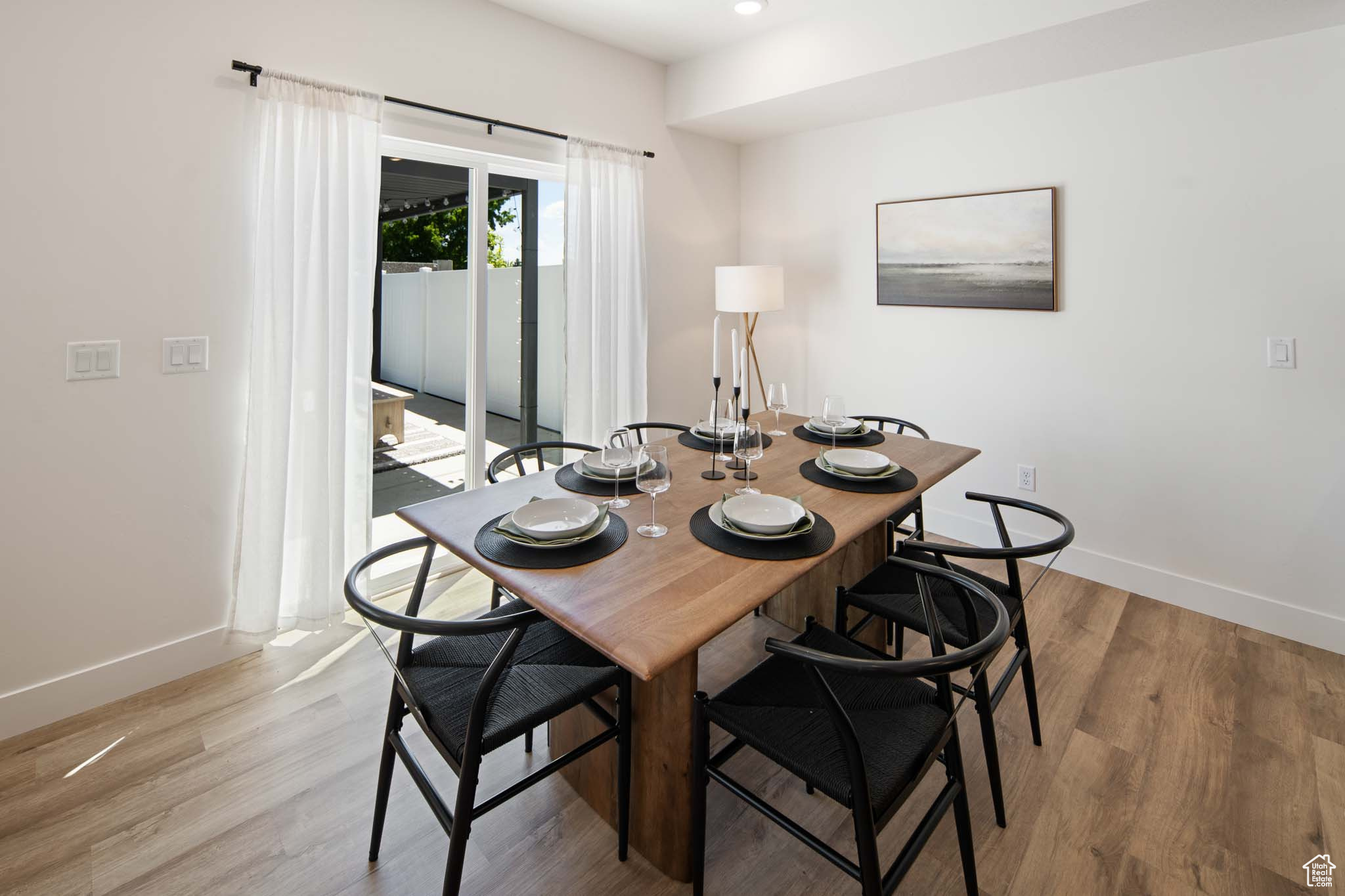 Dining area featuring recessed lighting, light wood-style flooring, and baseboards