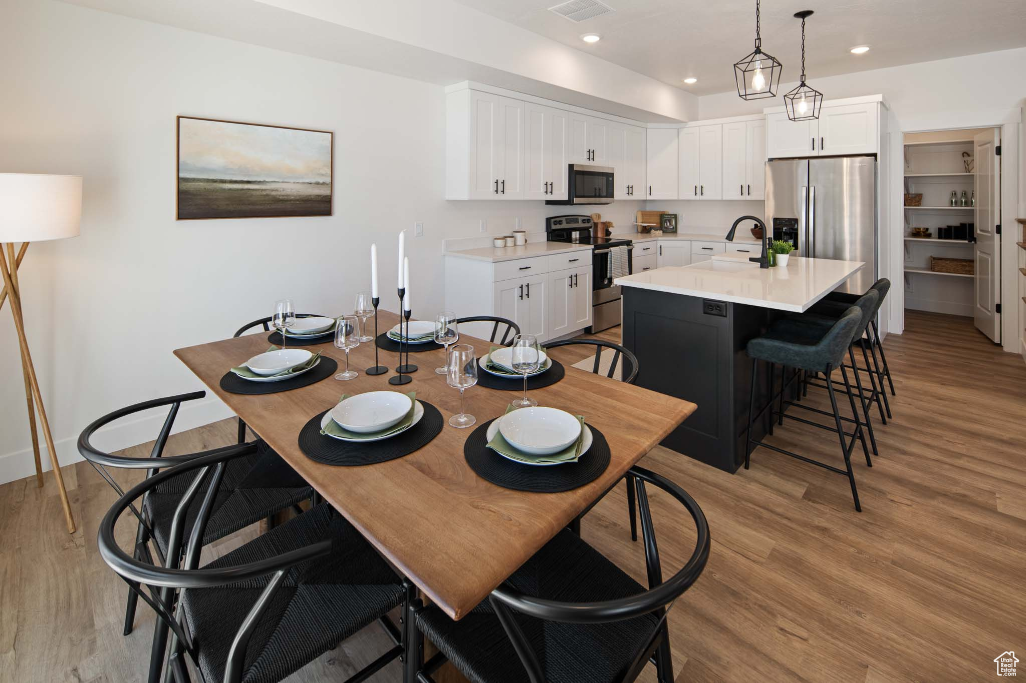 Dining area featuring recessed lighting, visible vents, light wood-style flooring, and baseboards