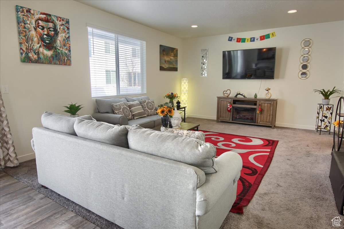 Living area featuring recessed lighting and baseboards