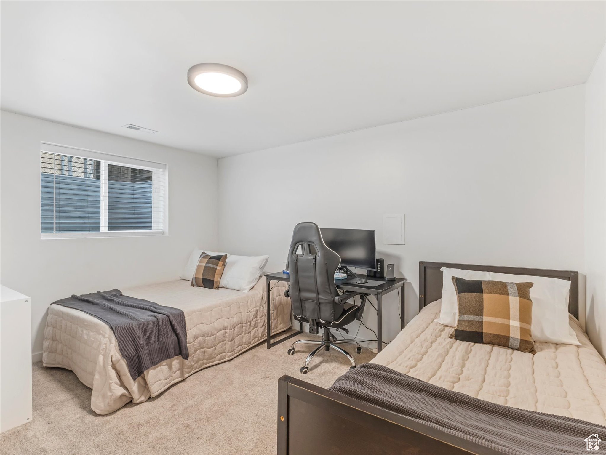 Bedroom featuring visible vents and carpet floors