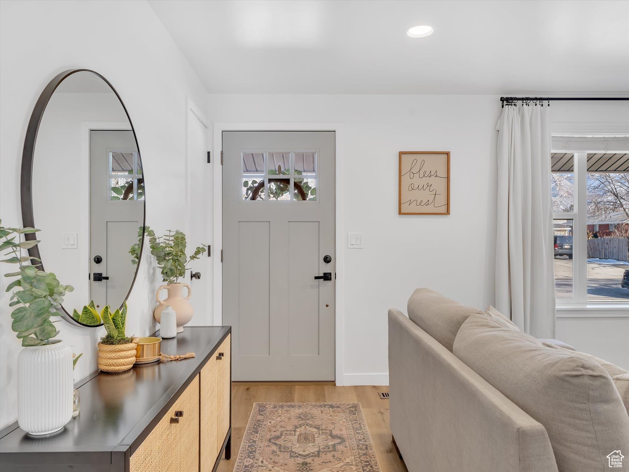 Foyer entrance featuring light wood-type flooring and recessed lighting