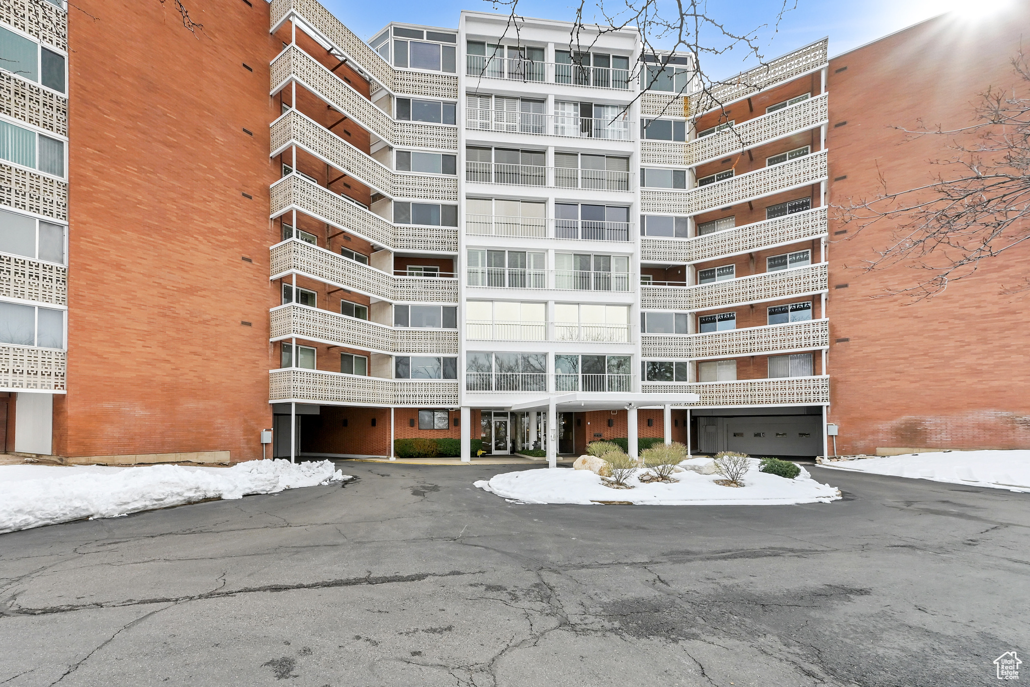 View of property with aphalt driveway