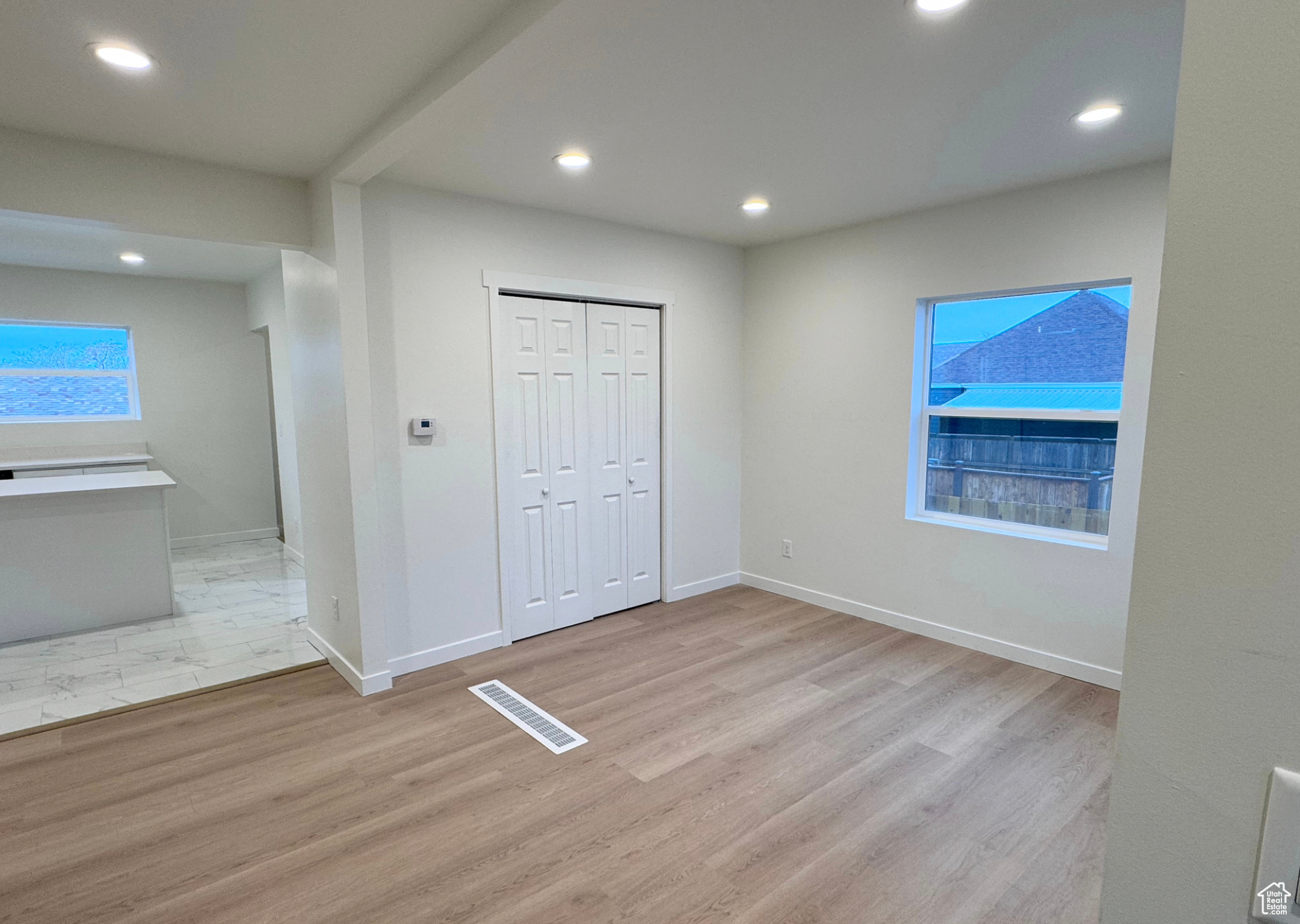 Unfurnished bedroom with recessed lighting, baseboards, visible vents, and light wood finished floors