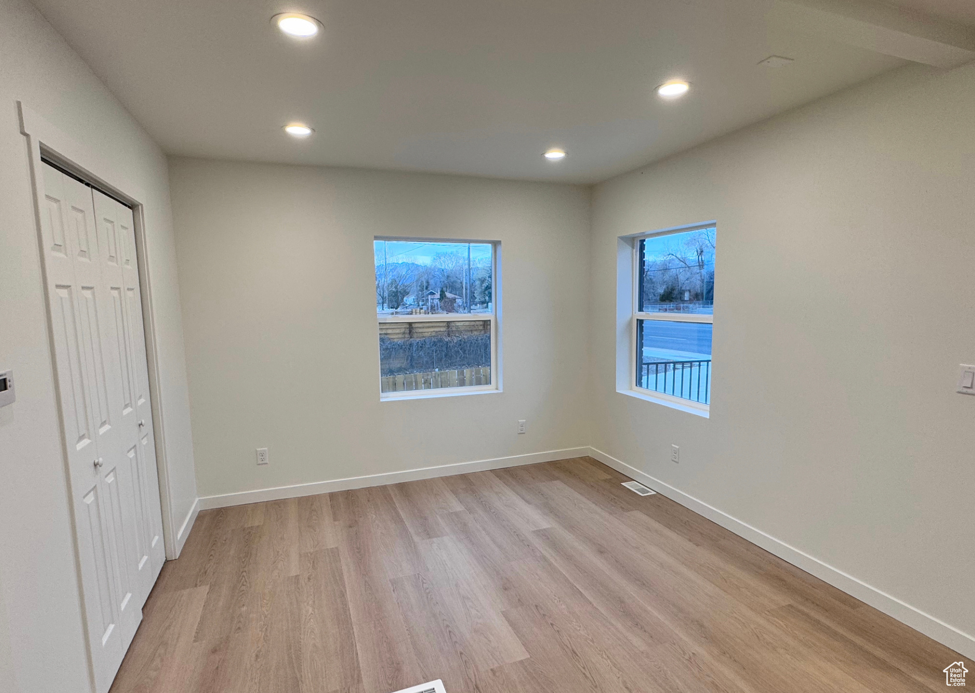 Unfurnished bedroom featuring light wood-style flooring, recessed lighting, visible vents, and baseboards