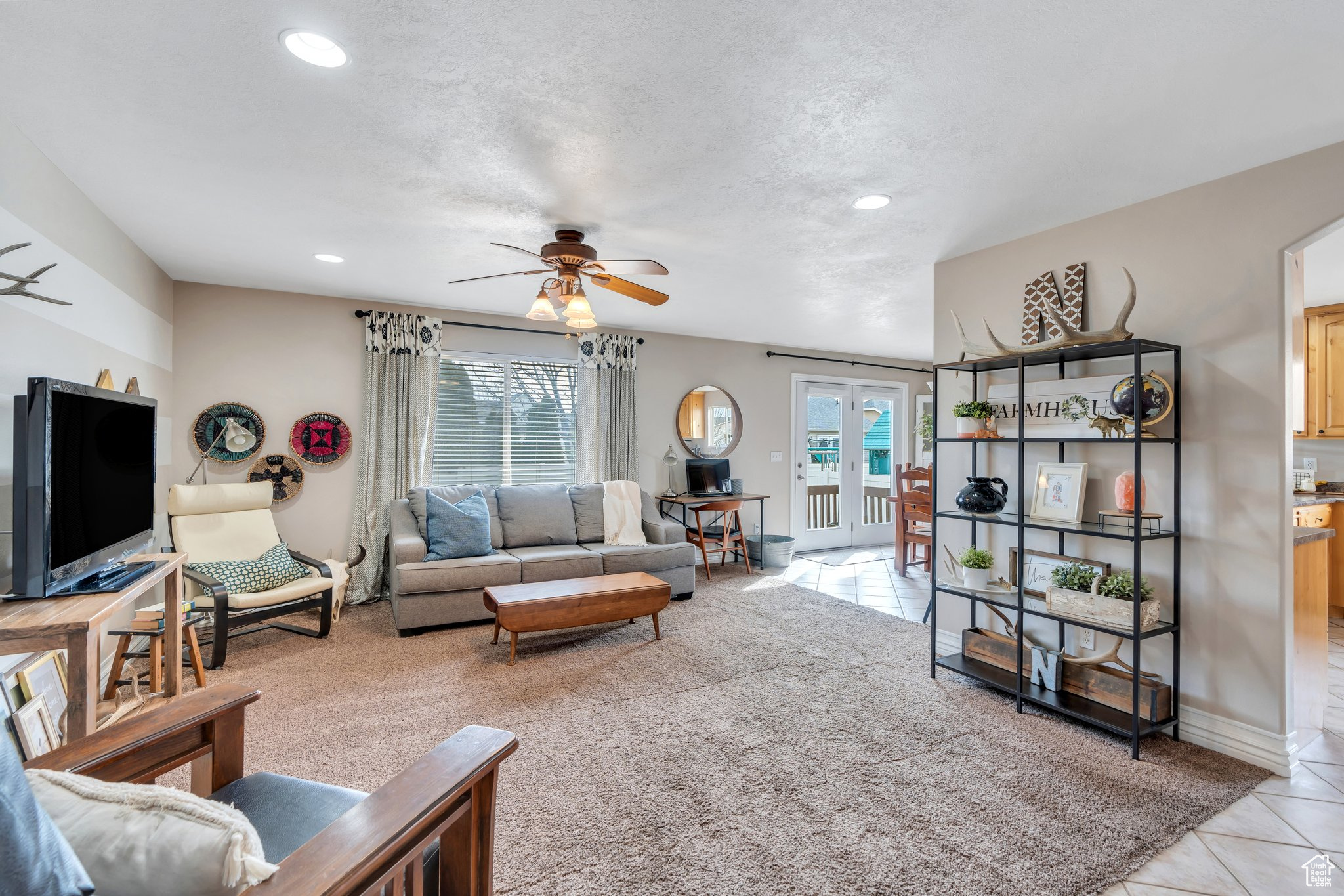 Living room featuring recessed lighting, baseboards, ceiling fan, a textured ceiling, and light tile patterned flooring