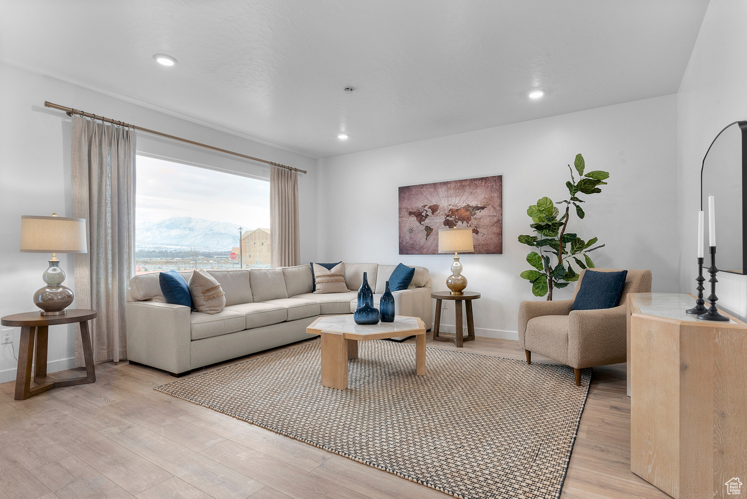 Living room featuring recessed lighting, baseboards, and light wood finished floors