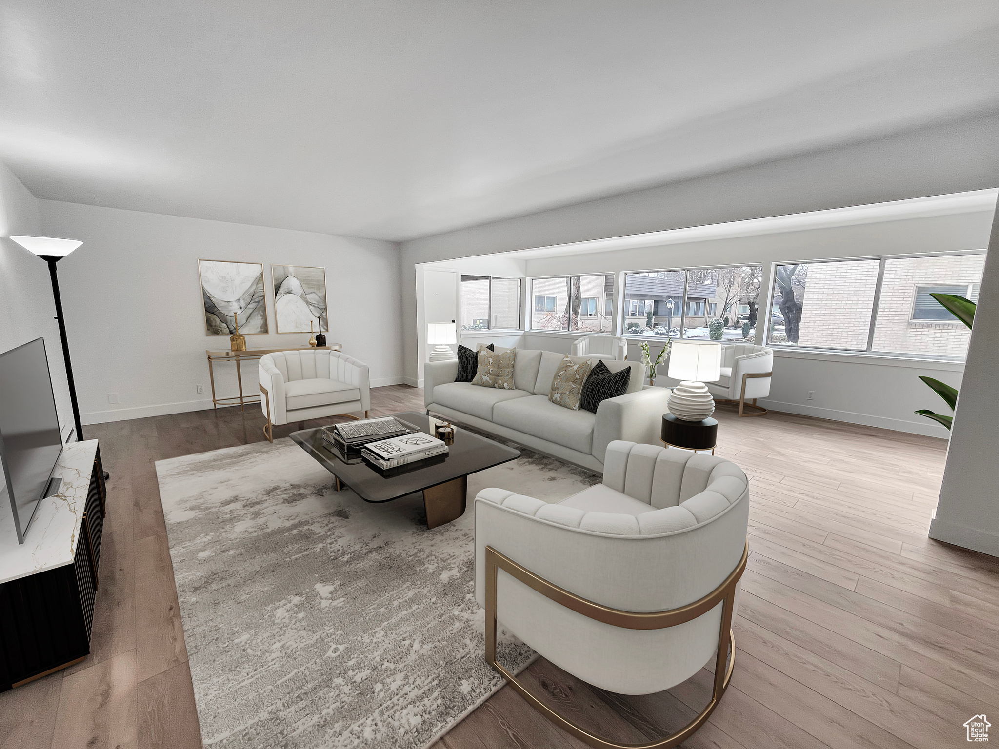 Virtually staged living area with light wood finished floors and convenient natural daylight