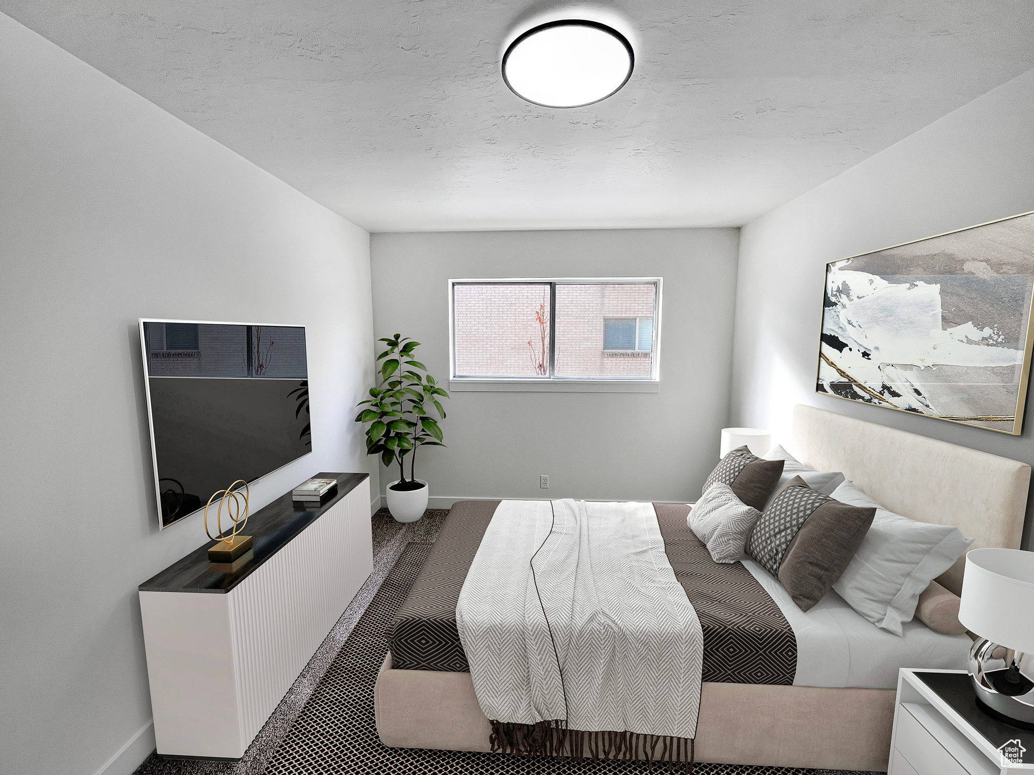 Virtually staged second bedroom featuring a large room and soft, new carpet