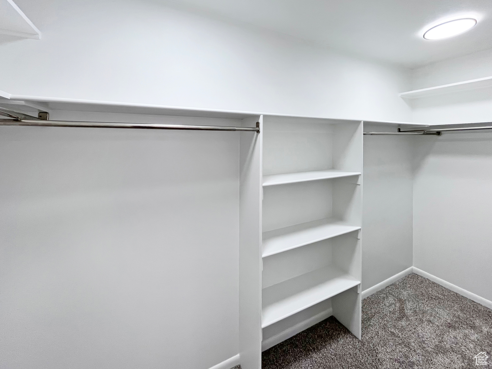 Spacious Master walk-in closet with built-in storage shelving
