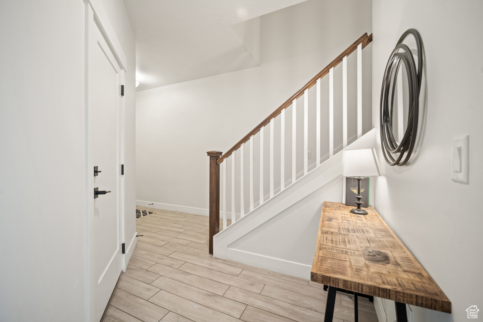 Stairs with baseboards and wood tiled floor