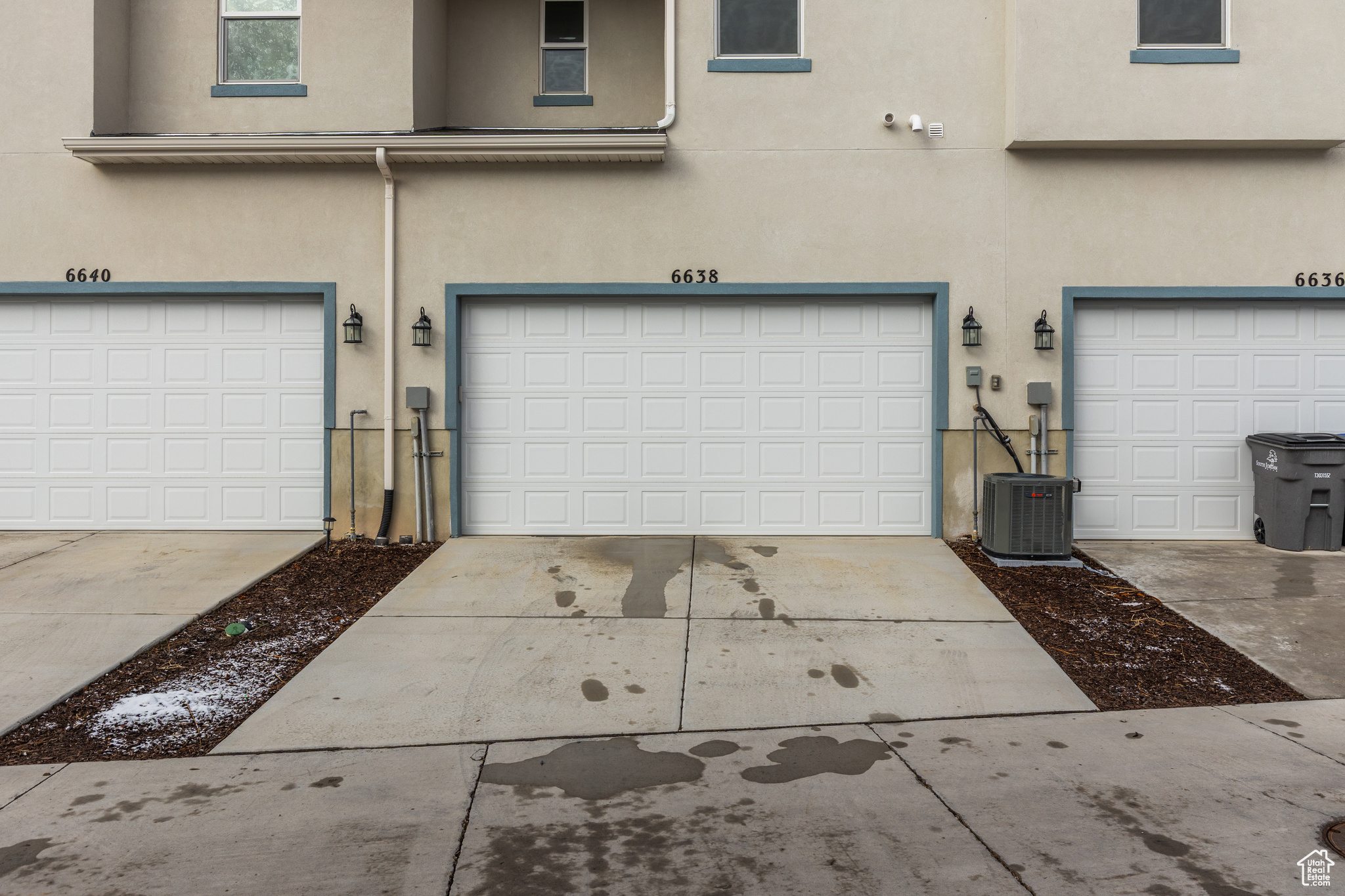 Garage with central AC and driveway