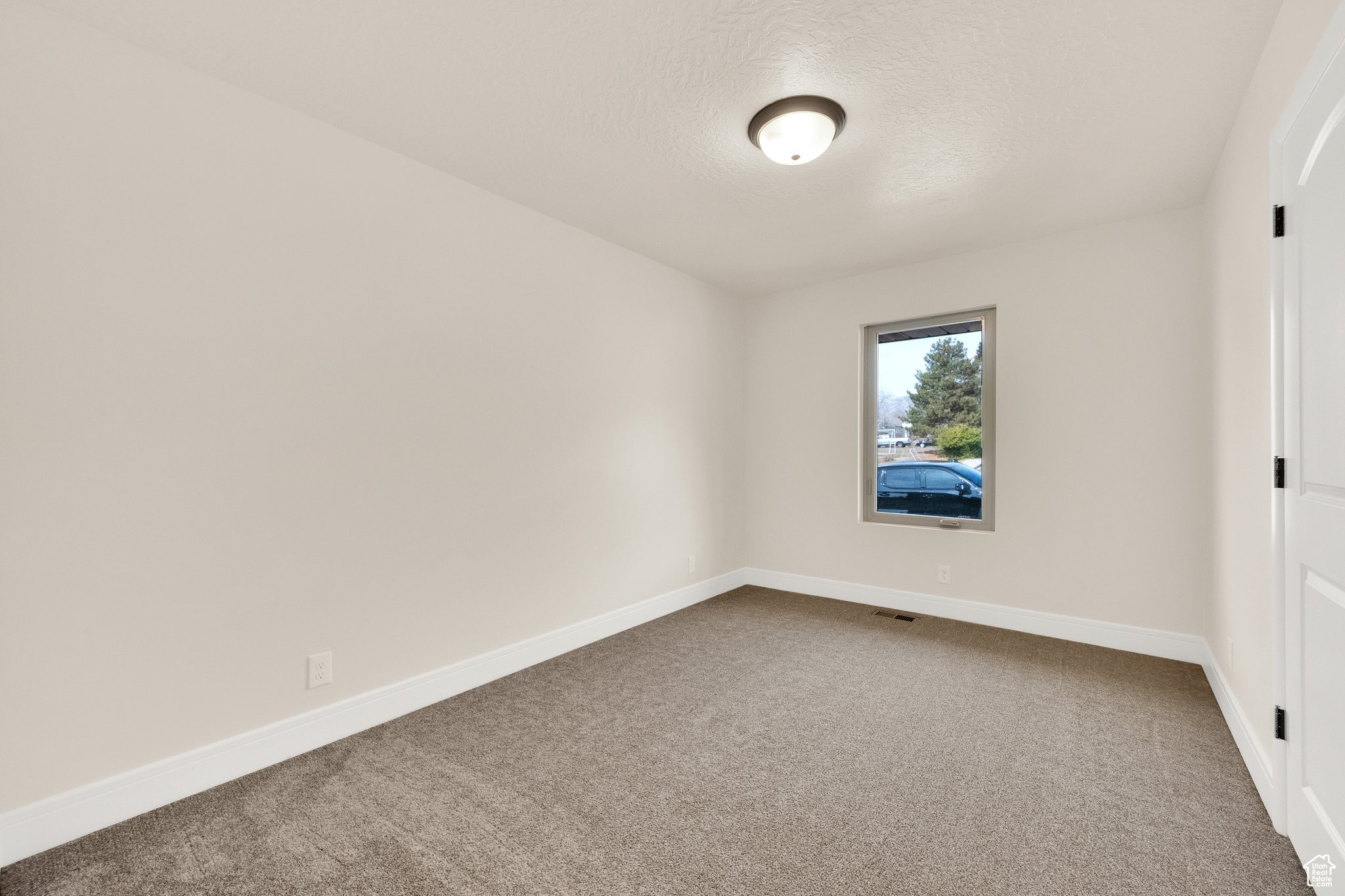 Bedroom new carpet, new paint, new casement window