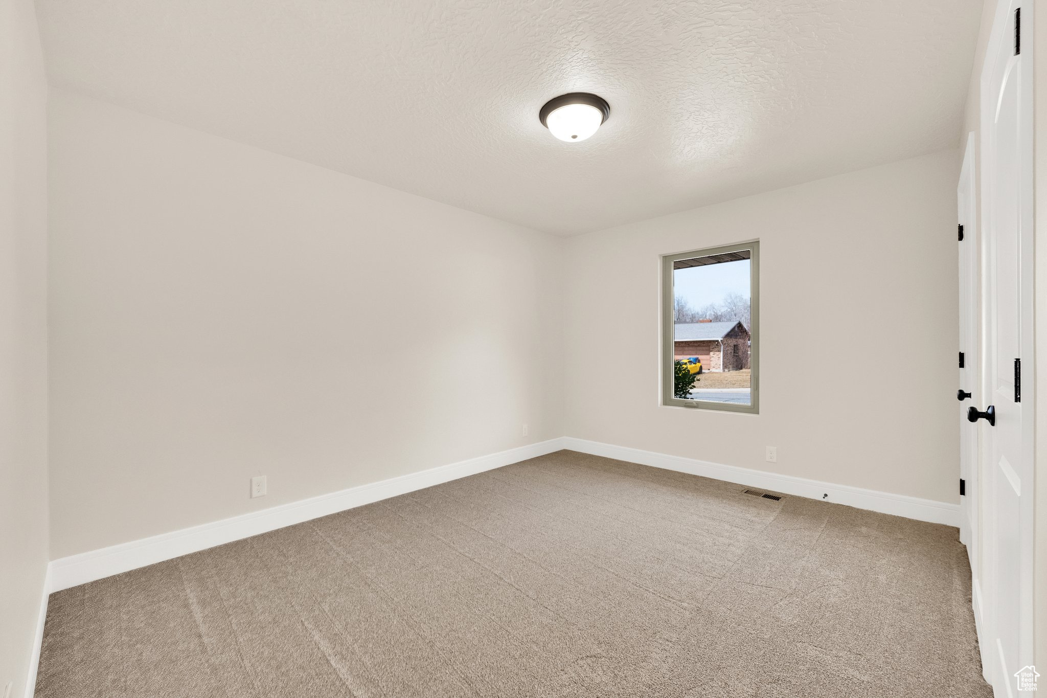 Bedroom new carpet, new paint, new casement window