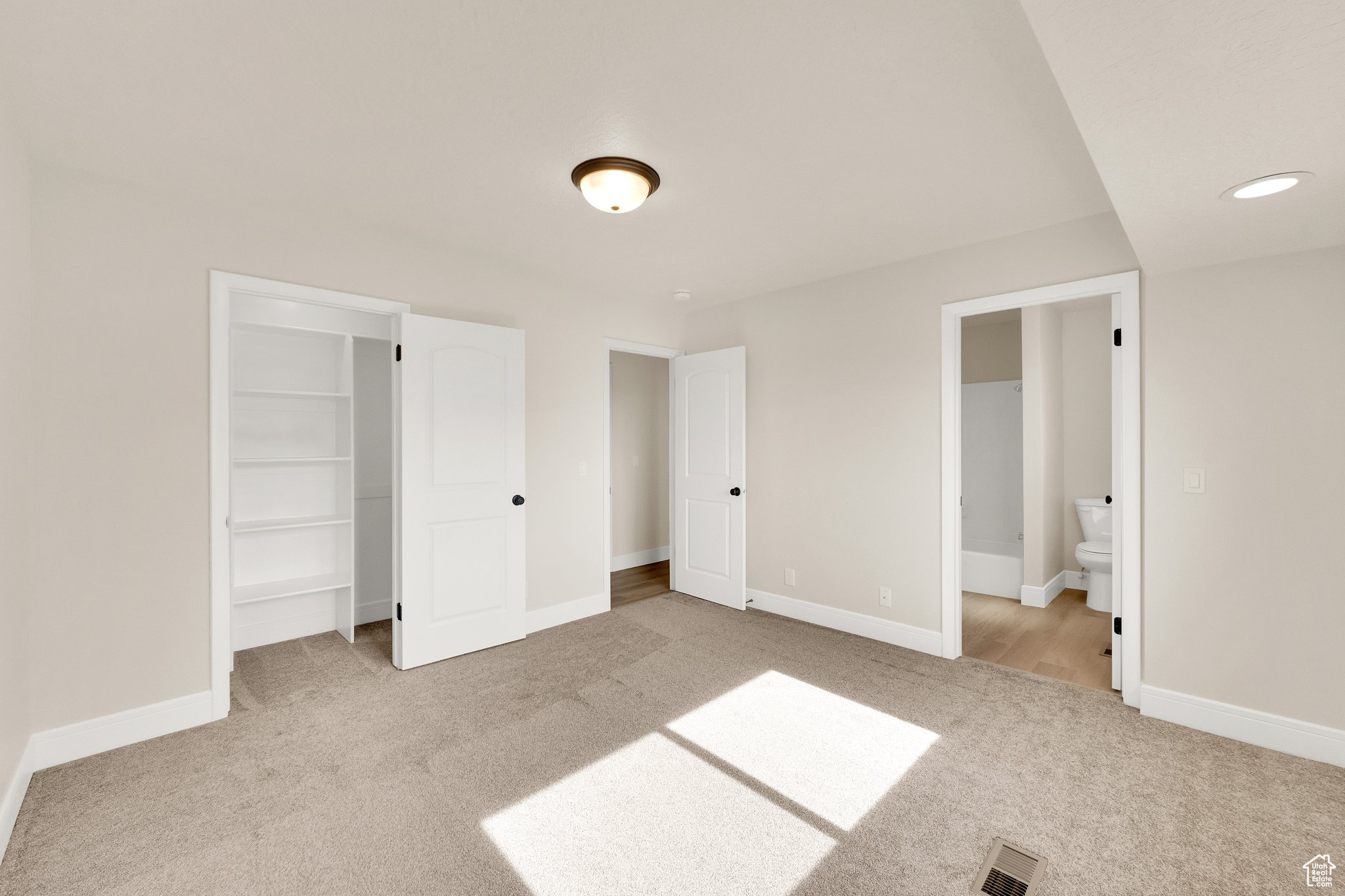 Walk in closet, primary bathroom