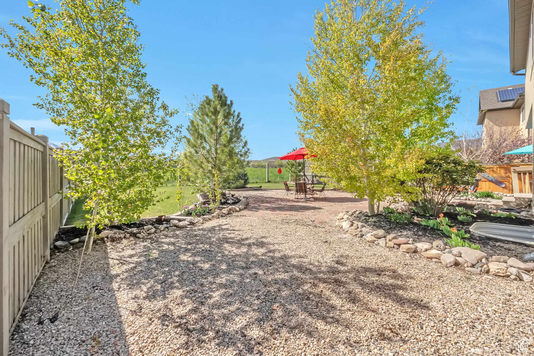 View of yard featuring a patio area and a fenced backyard