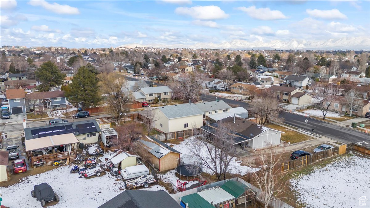 Snowy aerial view featuring a residential view