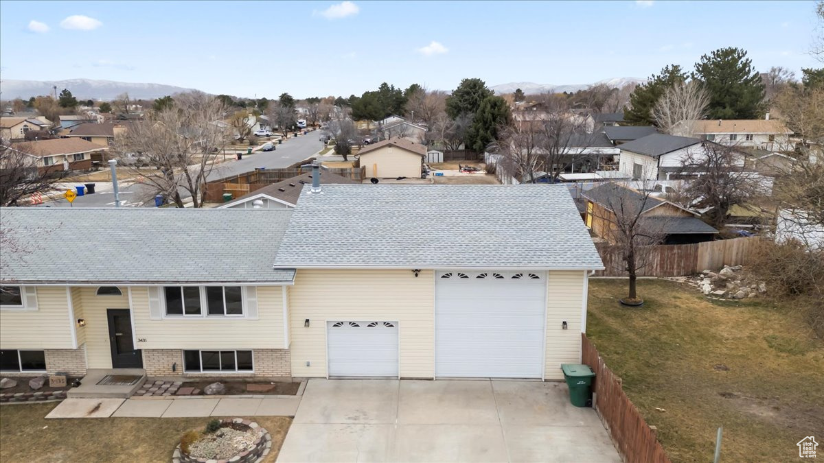 View of front of home featuring a residential view and a mountain view