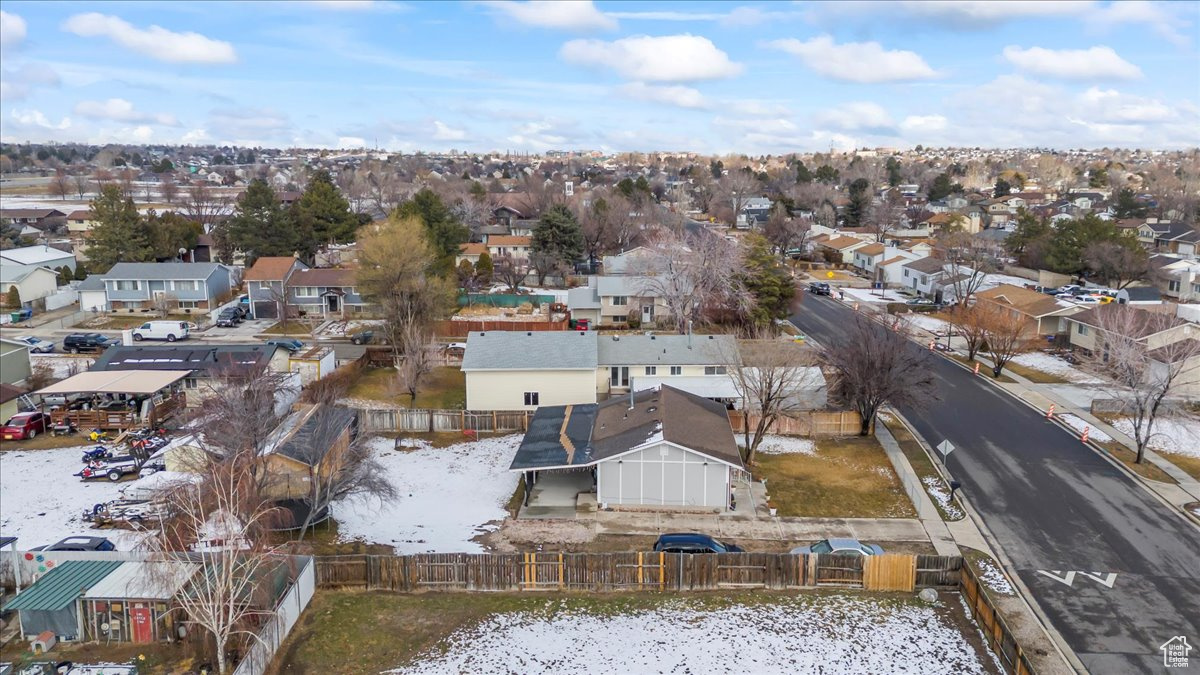 Birds eye view of property with a residential view