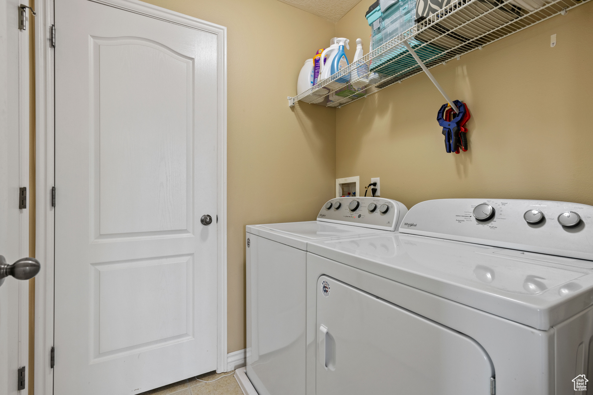 Laundry room with laundry area, washer and clothes dryer, and baseboards
