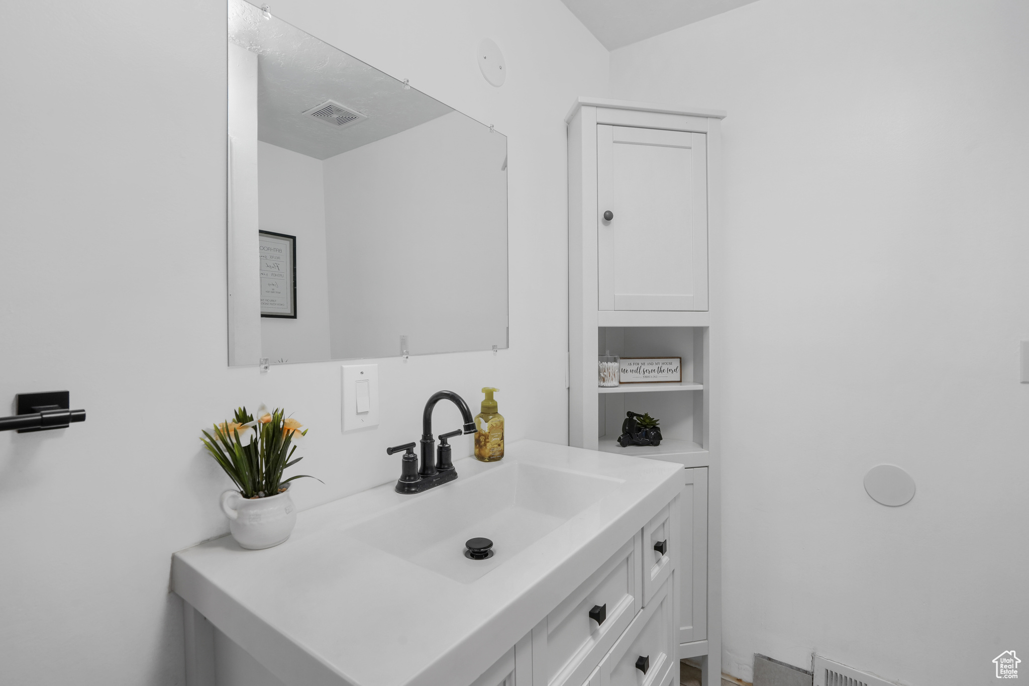 Bathroom featuring vanity and visible vents