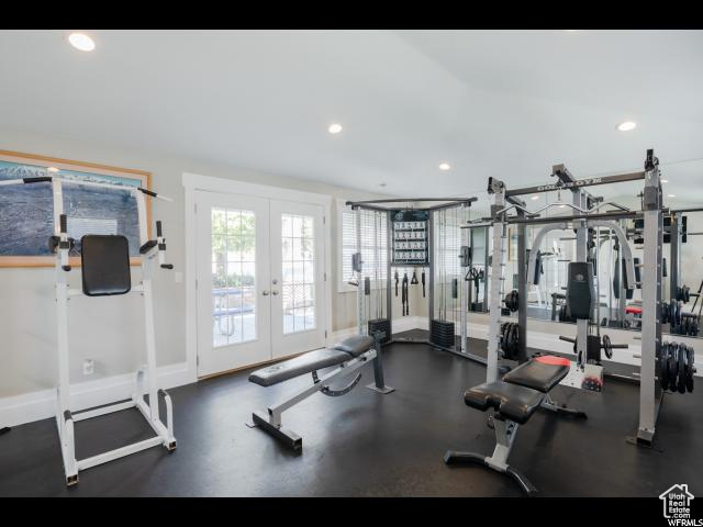 Exercise room with recessed lighting, french doors, and baseboards