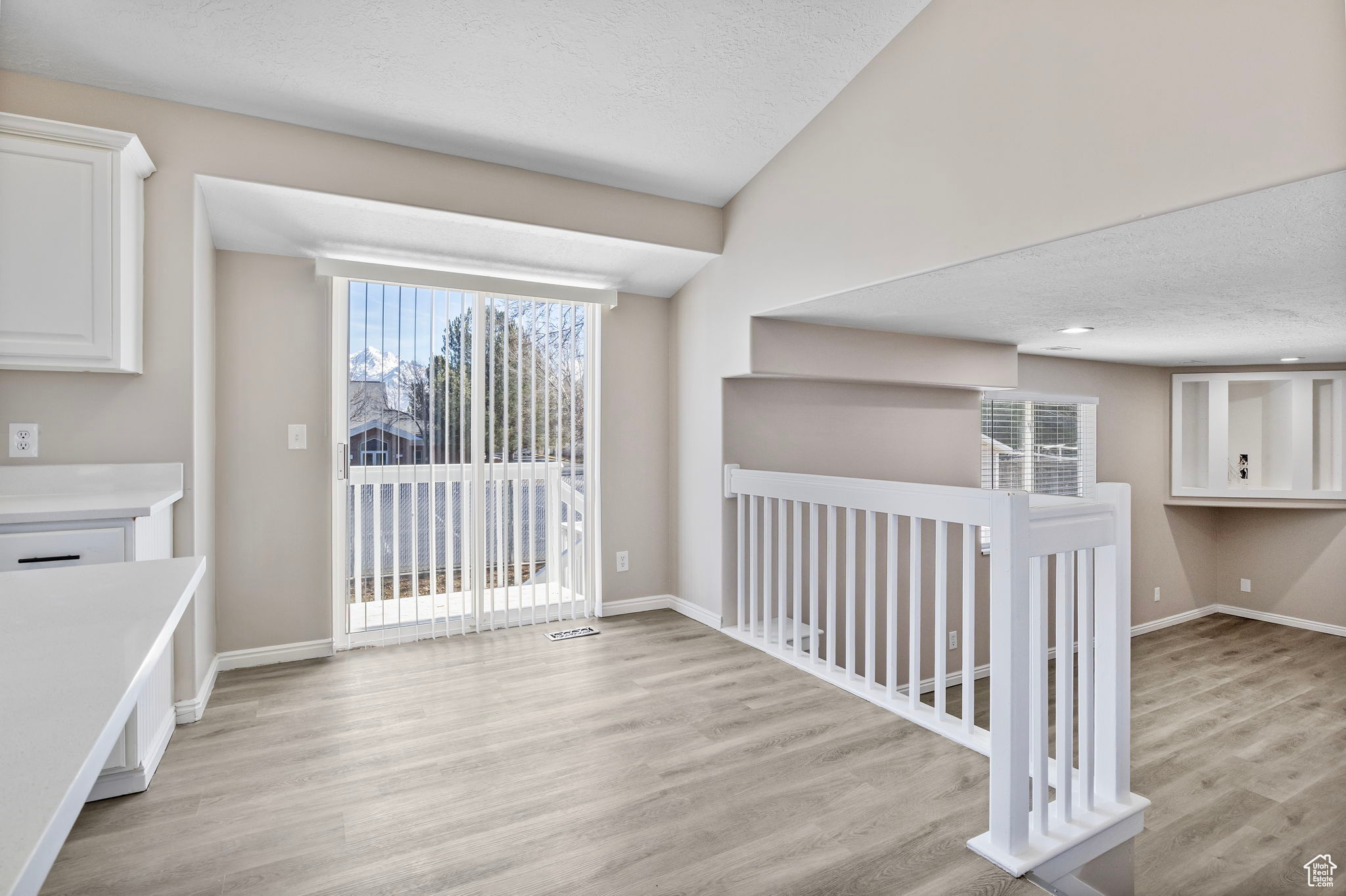 Interior space with light wood-type flooring, plenty of natural light, and baseboards